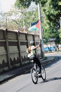Cyclist during the #FreePalestine solidarity ride in Mombasa
